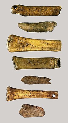 The Weser bones, 400-450 CE, were found on the lower Weser and are inscribed with Runes and images; individual bones show men attacking bulls and a Roman trading ship. The inscriptions may be curses. Weserknochen.jpg