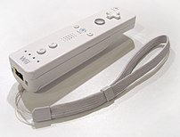 An image of the Wii remote (with wrist strap) ...