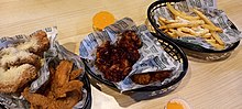 Wings and fries from Wingstop Wingstop chicken and chips.jpg