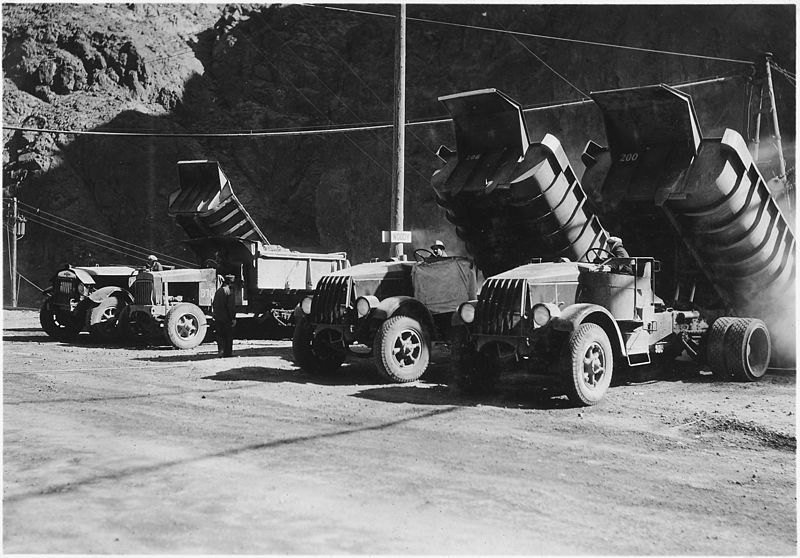 File:"Sixteen-yard trucks used in handling spoil on lower level operations in Black Canyon. Here trucks are dumping spoil... - NARA - 293800.jpg