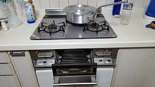 A built-in Japanese three burner gas stove with a fish grill. Note the thermistor buttons protruding from the gas burners, which cut off the flame if the temperature exceeds 250 degC. yakedoZhu Yi  (44294004191).jpg