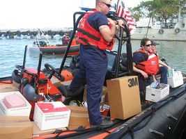 US Coast Guard delivering medical supplies by boat