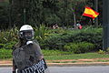 English: Riot police (in the background there is the spanish flag), Indignados Athens, Greece. Ελληνικά: Δύναμη των ΜΑΤ και στο πίσω μέρος της εικόνας διακρίνονται αγανακτισμένοι με την Ισπανική σημαία, Καλλιμάρμαρο, Αθήνα.