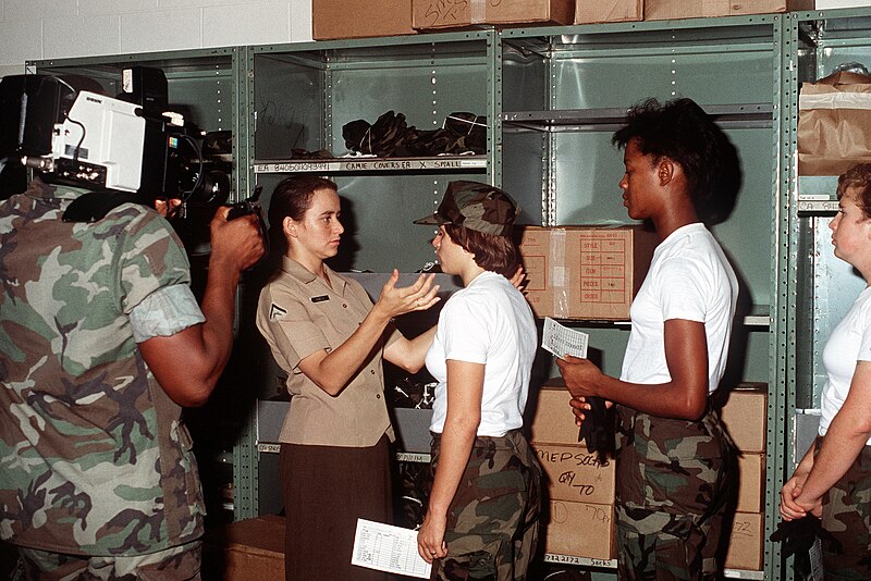 File:A cameraman videotapes recruits from the Woman Recruit Training Command as they receive their uniforms during basic training at the Marine Corps Recruit Depot - DPLA - 01acd9706e950844e56182660ddf32c7.jpeg