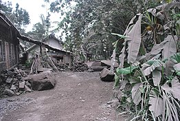 A village near Mount Merapi covered in ash from the volcanic eruption. A village covered in ash near Mt Merapi (10664028734).jpg