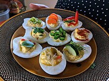 Assortment of deviled eggs Assortment of Homemade Contemporary Deviled Eggs.jpg