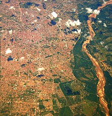 An aerial view of Santa Cruz, showing the city center and a portion of the Rio Parai. The city's ring road system is visible