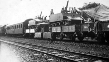 Vickers Armstrong "Type 76" SPAAG loaded onto a train. Boworadet Rebellion montage Vickers Type 76.png