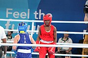 Deutsch: Boxen bei den Olympischen Jugendspielen 2018 Tag 12, 18. Oktober 2018 - Finale Fliegengewicht Mädchen – Martina La Piana (Italien, blau) schlägt Adijat Gbadamosi (Nigeria, rot) 5-0; Ringrichter ist James Beckles (Trinidad und Tobago). English: Boxing at the 2018 Summer Youth Olympics on 18 October 2018 – Girl's flyweight Gold Medal Bout - Martina La Piana (Italy, blue) beats Adijat Gbadamosi (Nigeria, red) 5-0; Referee is James Beckles (Trinidad and Tobago). Español: Boxeo en los Juegos Olímpicos Juveniles de Verano de 2018 en 18 de octubre de 2018 - Combate a medalla de oro de peso mosca para mujeres: Martina La Piana (Italia, azul) le gana a Adijat Gbadamosi (Nigeria, roja) 5-0; El árbitro es James Beckles (Trinidad y Tobago).