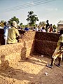 Building_of_mud_house_by_local_masons_in_Northern_Ghana