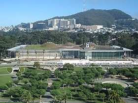 The new California Academy of Sciences building in San Francisco's Golden Gate Park has a green roof that provides 2.5 acres (10,000 m) of native vegetation designed as a habitat for indigenous species, including the threatened Bay checkerspot butterfly. According to the Academy's fact sheet on the building, the building consumes 30-35% less energy than required by code. CaliforniaAcademyofSciences.jpg