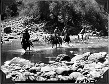 Ethiopian caravans crossing river in 1927 Caravan crossing a river (3948802144).jpg