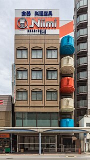 Thumbnail for File:Coffee cup-shaped balconies, Niimi Tableware, Kappabashi Dougu Street, Tokyo, Japan (front view).jpg