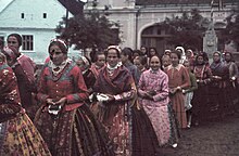 Hungarian women walking whilst holding prayer books (1940) Colorful, women, folk costume, prayer book Fortepan 92580.jpg