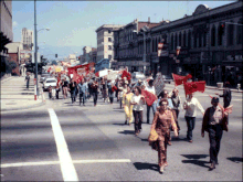 Image of members of the United Farm Workers marching down a street Cultural Heritage Center historical image. - 2532526452.gif