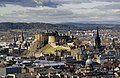 Image 8Edinburgh Castle is a fortress which dominates the skyline of the city of Edinburgh, from its position atop the volcanic Castle Rock. Human habitation of the site is dated back as far as the 9th century BC, although the nature of early settlement is unclear. There has been a royal castle here since at least the reign of King David in the 12th century, and the site continued to be a royal residence until the Union of the Crowns in 1603.