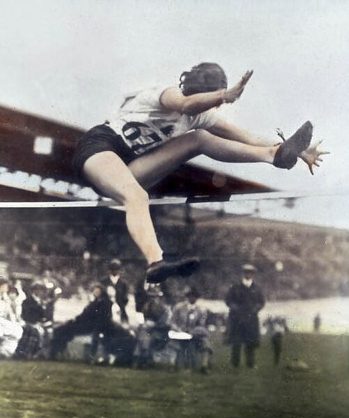 Gold medal winner Ethel Catherwood of Canada scissors over the bar at the 1928 Summer Olympics. Her winning result was 1.59 m (5 ft 2+1⁄2 in).