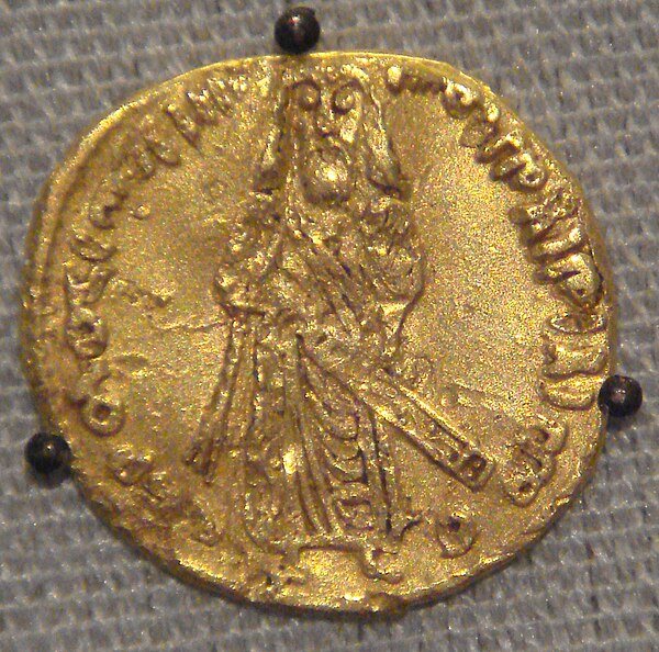 Gold dinar minted by the Umayyads in 695, which likely depicts Abd al-Malik.