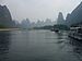 Tall karst mountains in the mist seen from the Li river