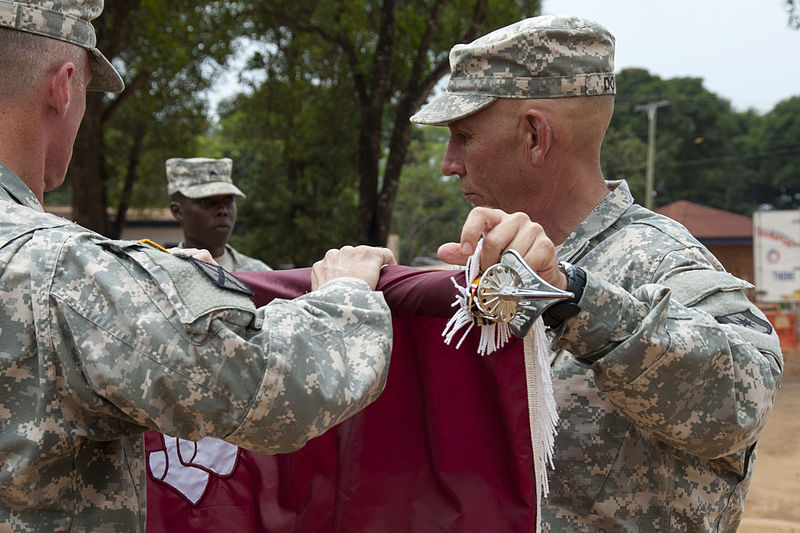 File:Fort Campbell based 86th Combat Support Hospital cases colors in Liberia 150212-A-CH600-074.jpg