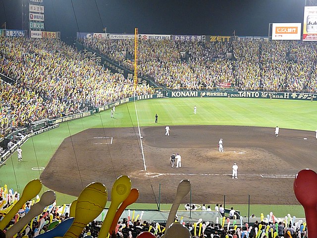 Fans about to release balloons during the 7th inning stretch