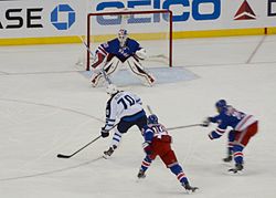 Albert Winnipeg Jetsin paidassa NHL-debyytissään 2. joulukuuta 2013 tekemässä ensimmäistä NHL-maaliaan New York Rangersin Cam Talbotin taakse.