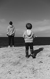 Jules and Gabriel looking at the sea, Porto Covo, Portugal