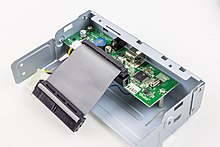 PATA to USB Adapter. It is mounted on the rear of a DVD-RW optical drive inside an external case. LG Super Multi GSA-E40N - PATA 2 USB Adapter-8672.jpg