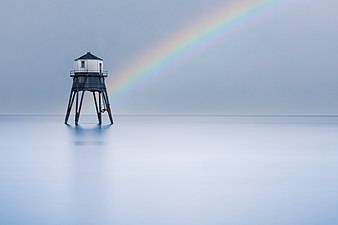 Lighthouse with rainbow (51218604391).jpg