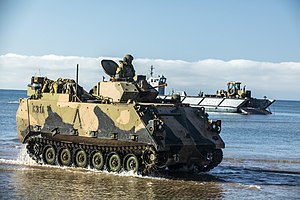 Colour photo of a tracked military vehicle in the water