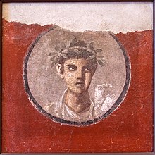 MANNapoli 120620 a Fresco young man with rolls from Pompeii Italy.jpg