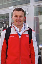 Marcel Fassler (pictured in 2015) helped achieve the No. 7 Audi's ninth overall win. Marcel Fassler 2013 WEC Silverstone.jpg