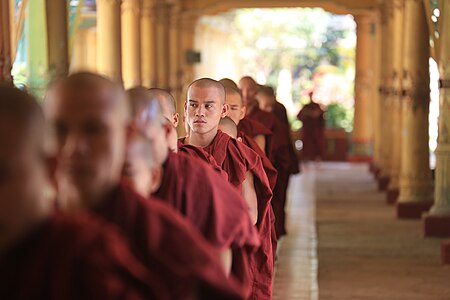 Monks in the queue for their meal at the monastery Kha Khat Wain Kyaung in Bago, Myanmar.