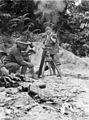 Soldiers from the 2/48th Infantry Battalion fire a 3-inch mortar at a Japanese-held ridge on 6 May