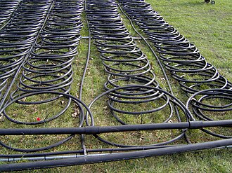 Loop field for a 12-ton of refrigeration/42 kW system (unusually large for most residential applications) Pond Loop Close Up.jpg