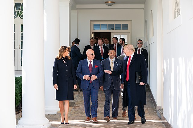 President Trump and First Lady Melania Trump walking with Nationals General Manager Mike Rizzo and Martinez before attending the celebration of the 20