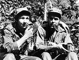 Raul Castro (left) and Che Guevara (right) in their Sierra de Cristal Mountain stronghold south of Havana, in 1958. It was during this time as a guerilla commander in the Cuban Revolution, that Guevara would base his theory of a foco centered revolution. Raulche2.jpg