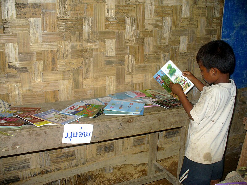 File:Reading time in Laos - Big Brother Mouse book corner.jpg