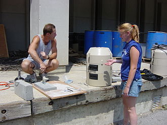 Environmental scientists preparing water autosamplers. Research- water sampling equipment.jpg