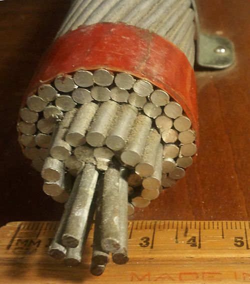 A typical ACSR. The conductor consists of seven strands of steel surrounded by four layers of aluminium.