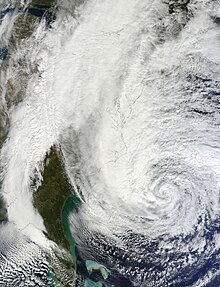 A tilted satellite image of the storm on October 28, with most of the U.S. coastline artificially highlighted. The entire east coast is visible, with a cloudless Florida coast seen at the bottom of the image and the outline of the coast of Maine at the top right. Sandy 2012-10-28 1600Z.jpg