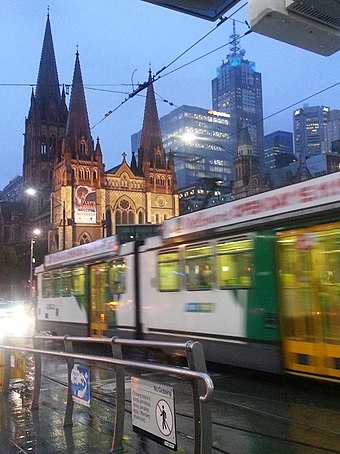 A tram passing St Paul's Anglican Cathedral, Flinders Street