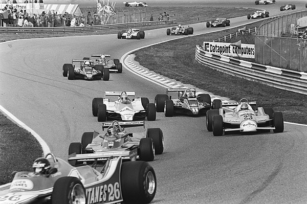 Drivers battling at the start behind the head of the race