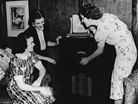 StateLibQld 1 105248 Group of friends gathered around a radio in Brisbane, ca. 1942.jpg