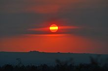 Haze over the Mojave Desert from a brush fire in Santa Barbara, California, seen as the Sun descends on the 2016 June solstice, allows the Sun to be photographed without a filter. Striped Sun at Summer Solstice 2016.jpg