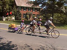 Burley Piccolo, behind a triple tandem TeddyChauffersSml.jpg