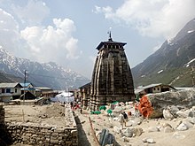 Rear view of the Kedarnath Temple in the aftermath of the flood with the huge rock that protected the temple. Temple in the aftermath of the flood.jpg