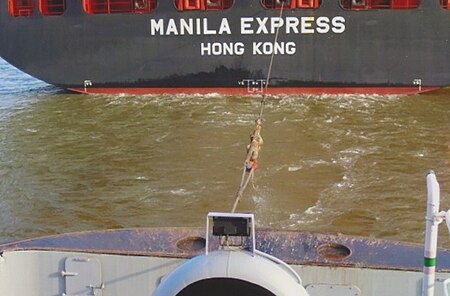 The stern tow rope is fixed to the container ship Manila Express, the drag is started.jpg