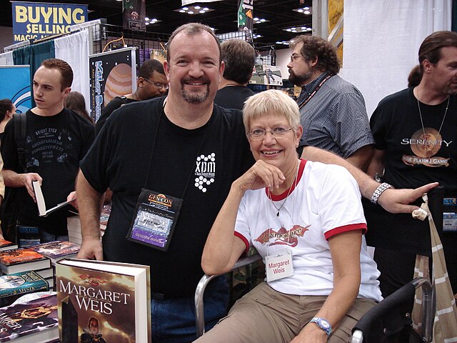 Margaret Weis (seated) with Tracy Hickman at Gen Con Indy 2008