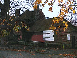 The solar wing (south front, facing The Boulevard). The blacked-out sign showed the services offered by the voluntary sector and Borough Council in the building until 2006 Tree House, 103 High Street, Crawley (South Face) (IoE Code 363351).JPG